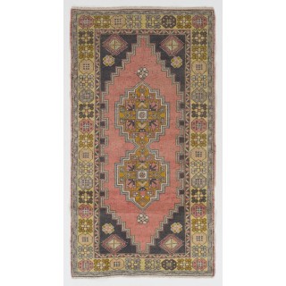 Vintage Hand Knotted Wool Turkish Area Rug with Geometric Design in Muted Colors
