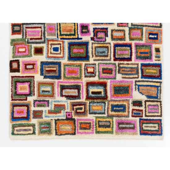 Vibrant Modern Hand-knotted Tulu Rug with with colorful geometric boxes on an ivory background. 100% Wool. Custom Options Available Vibrant Modern Hand-knotted Tulu Rug with with colorful geometric boxes on an ivory background. 100% Wool. Custom Options Available