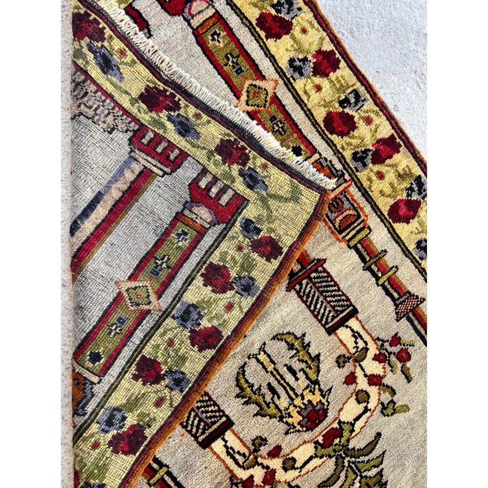 Vintage Turkish Prayer Rug depicting an Archway, Columns and Flowers Vintage Turkish Prayer Rug depicting an Archway, Columns and Flowers