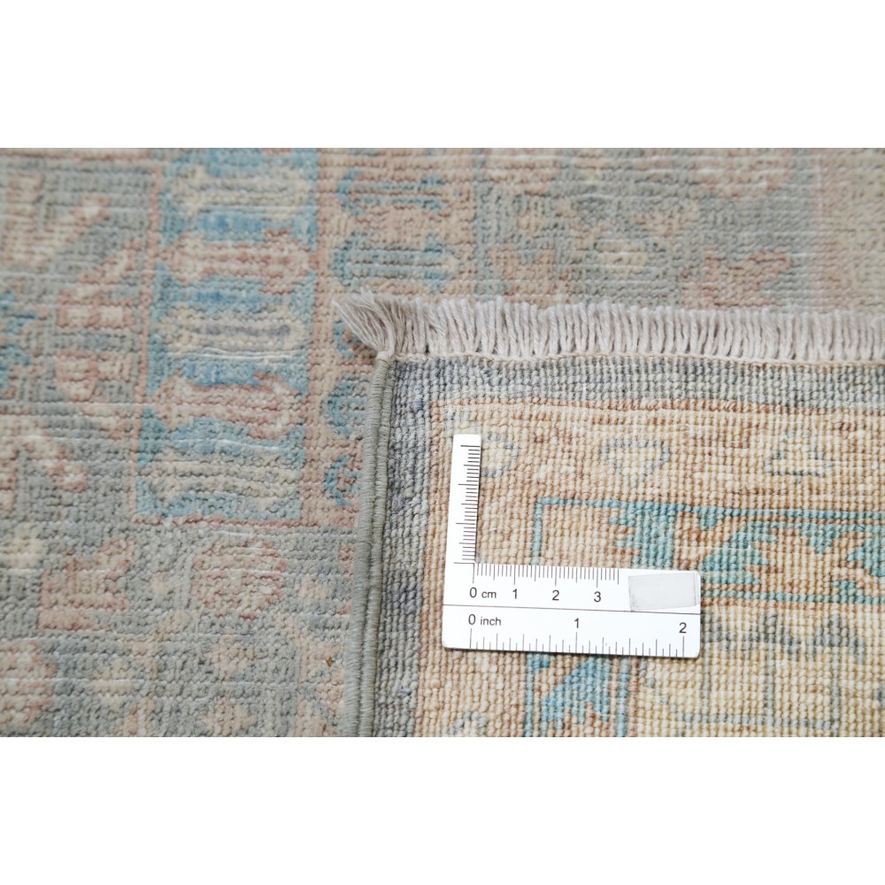 Hand Knotted Turkish Geometric Wool Area Rug in Soft Tones Hand Knotted Turkish Geometric Wool Area Rug in Soft Tones