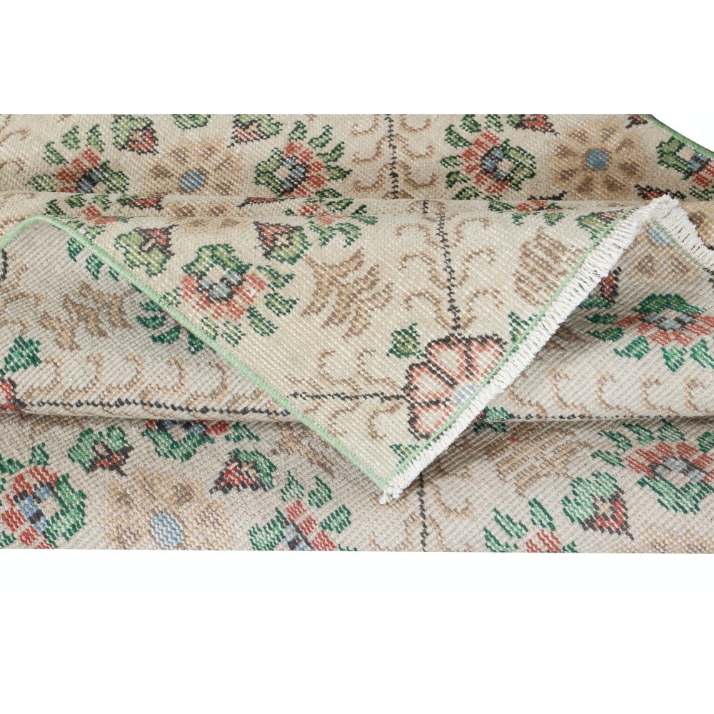 Handknotted Vintage Anatolian Rug with Beige Background and Green Floral Pattern