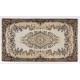 Hand-Knotted Vintage Turkish Area Rug with Medallion Design in Neutral Colors. Woolen Floor Covering Hand-Knotted Vintage Turkish Area Rug with Medallion Design in Neutral Colors. Woolen Floor Covering